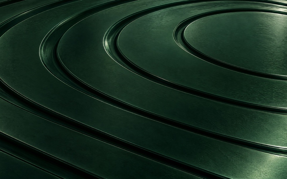 Anéis concêntricos em relevo sobre metal verde-esmeralda escuro